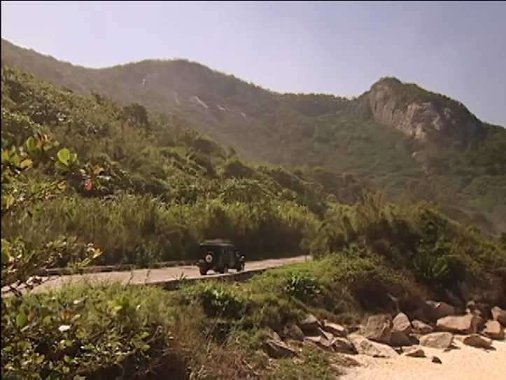 Lucas arrives at Prainha in a green jeep