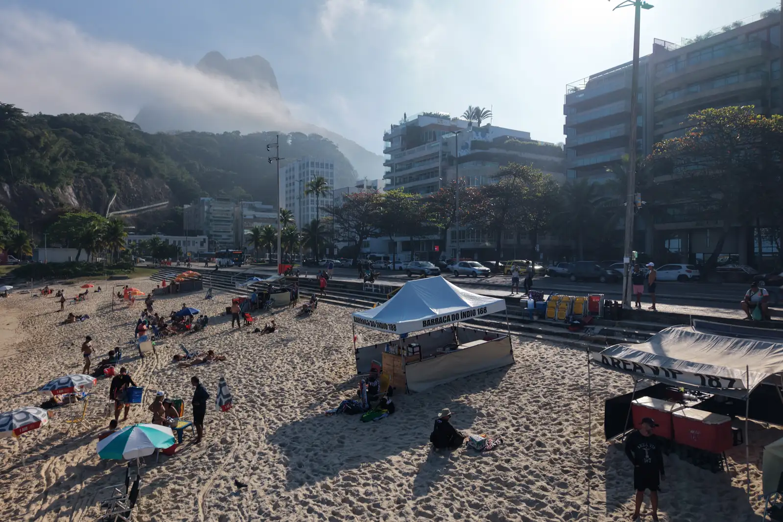 Beach kiosks and visitors at Praia do Leblon near Posto 12 in Rio de Janeiro