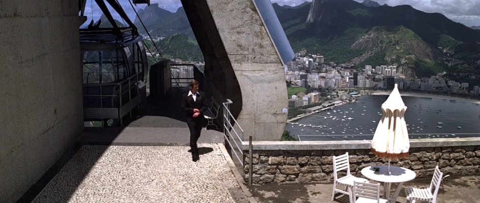 Bond arrives at the upper cable car station