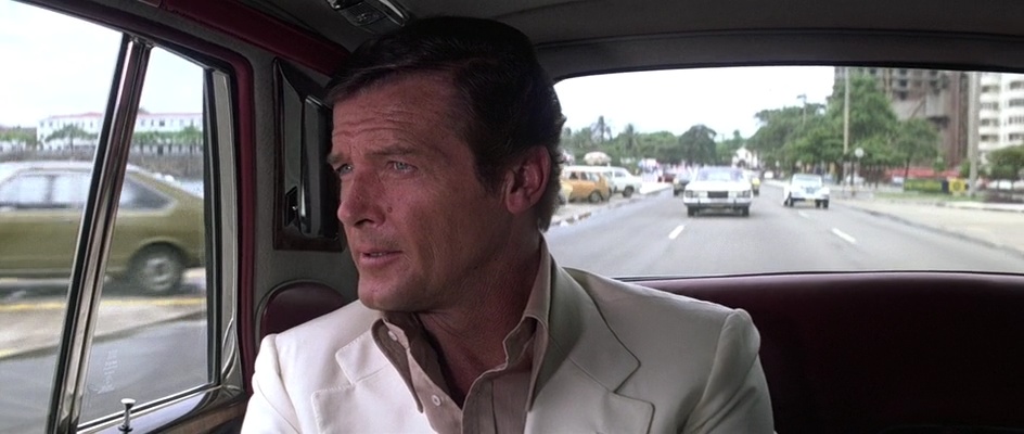 Bond looks out from the Rolls-Royce on the Copacabana waterfront