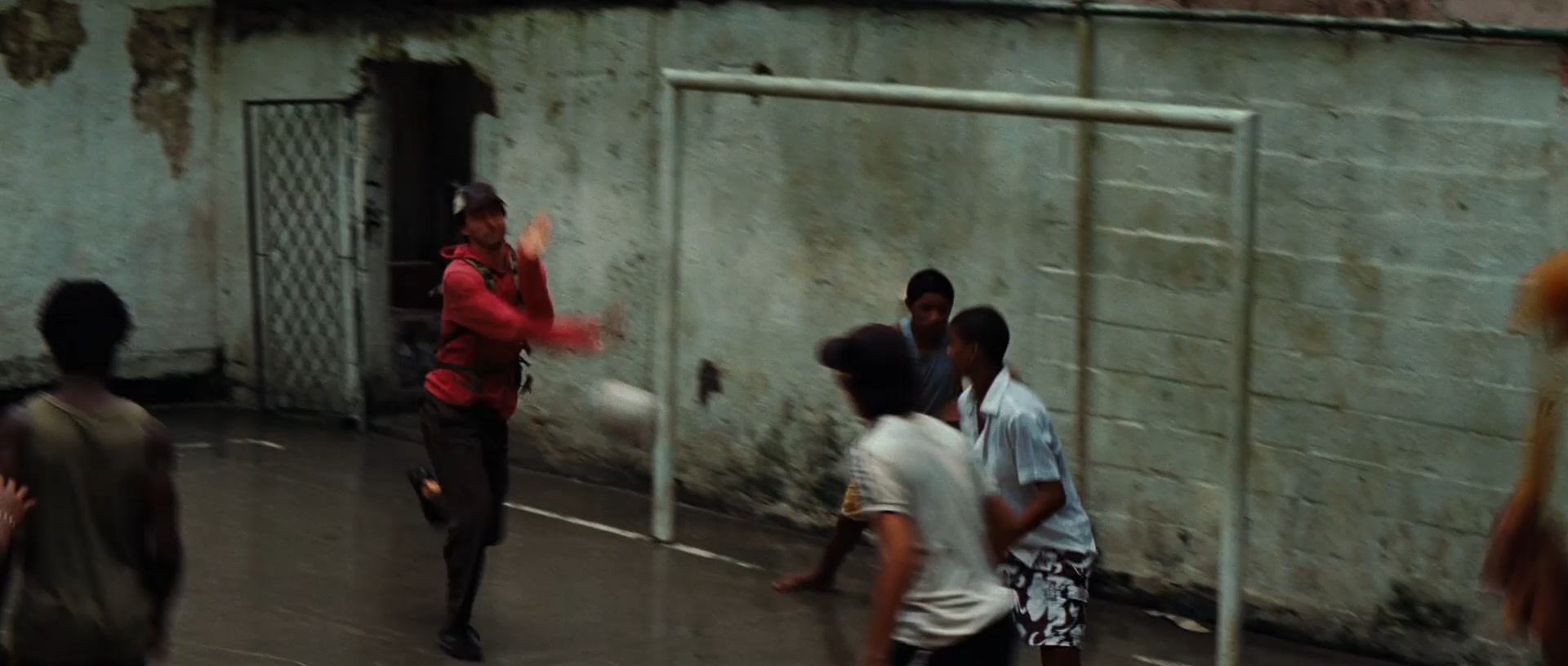 Emil Blonsky crosses the Tavares Bastos football court during the pursuit