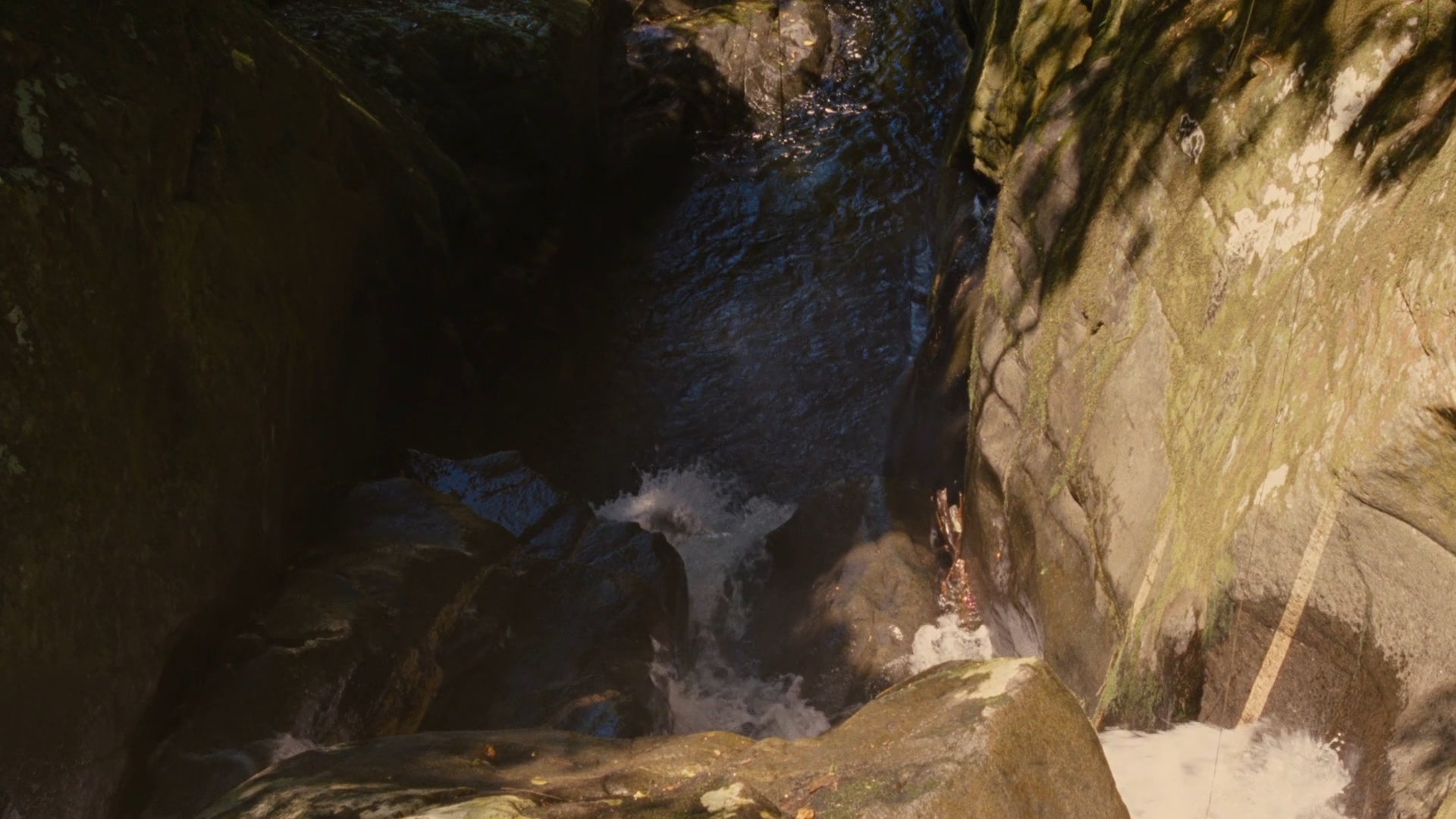 The narrow rock pool above the cascade