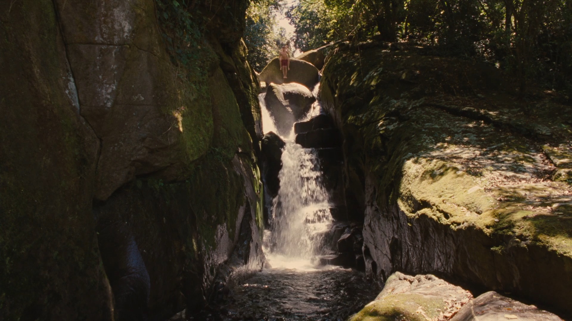 Bella prepares to jump into the waterfall