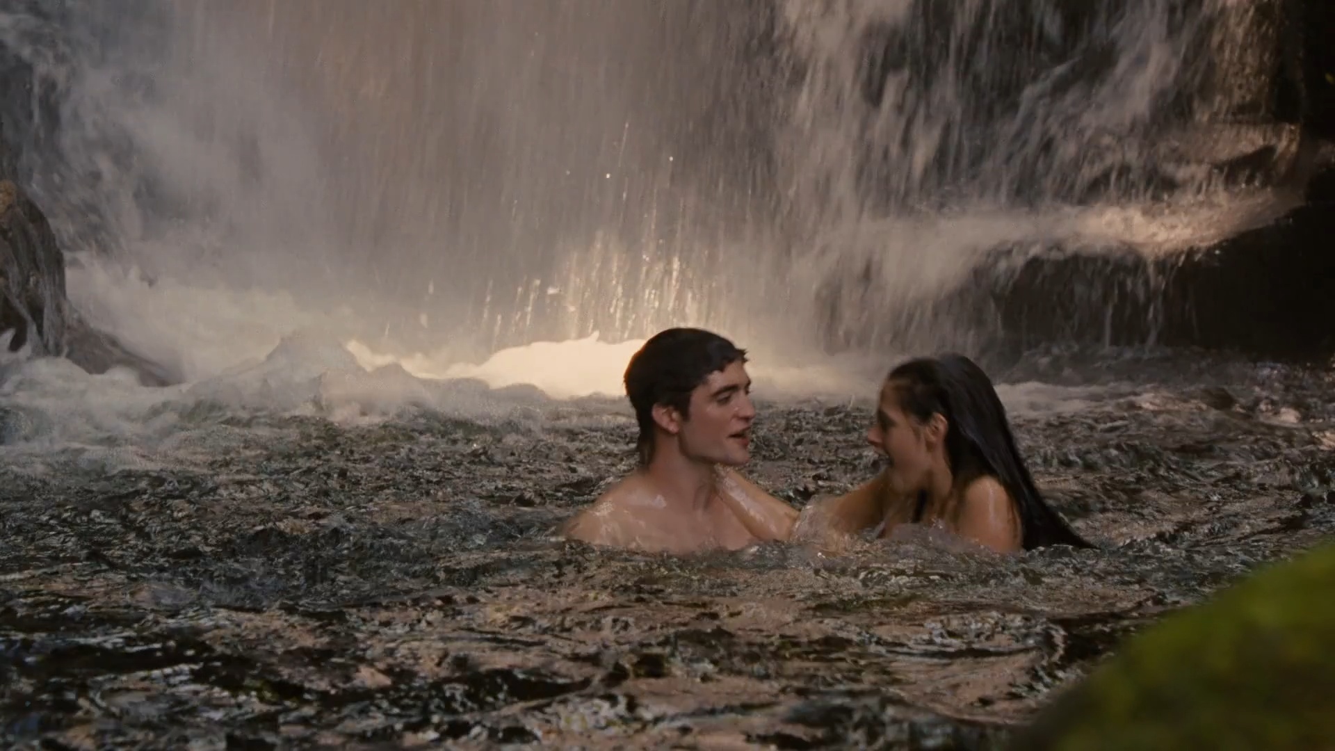 Bella and Edward swim beneath the cascade